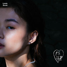 Load image into Gallery viewer, PS ILY Skull earrings as worn on ear.