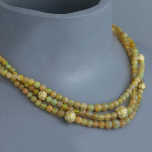 Ethiopian Opal Torsade with Diamond Star Set Gold Spheres