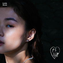 Load image into Gallery viewer, PS ILY Skull earrings as worn on ear.
